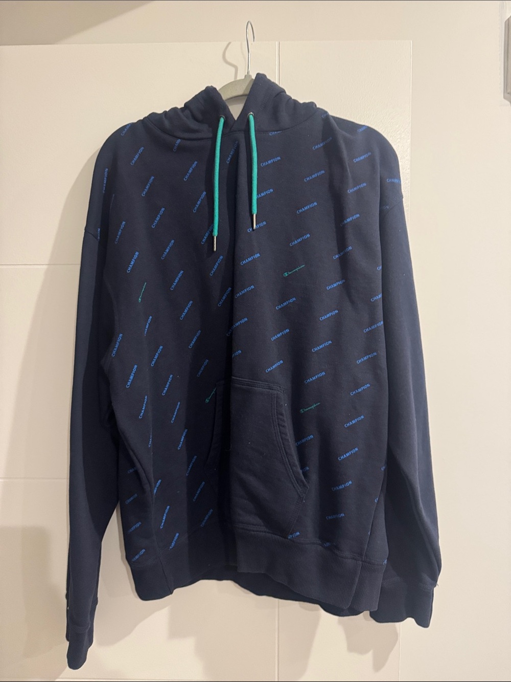 Champion Navy Hoodie with Teal Drawstrings and Blue Logo Print